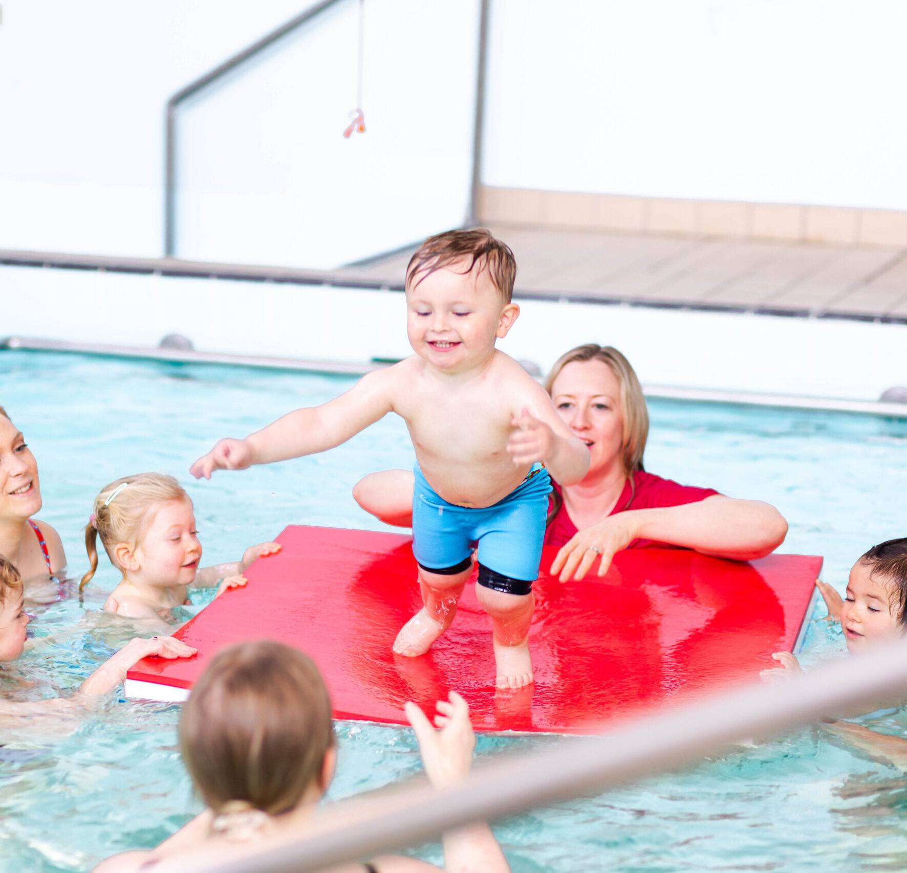 fun jumping off the mat in the pool